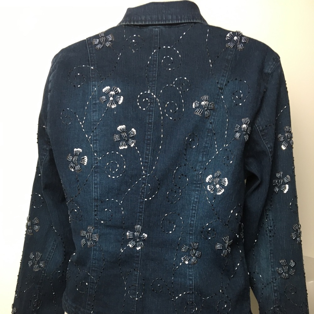 Dark denim princess cut beaded jacket.